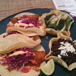 Madero Cantina - Fish tacos with spicy Chipotle sauce, shredded cabbage, and pico. Spicy spicy poblanos with grilled onions. black beans!