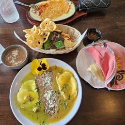 Huevos Divorce (front) and queso fundido with chorizo (back)