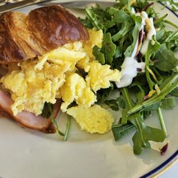 incredible house-made croissant make the ham and cheese and eggs inside sing...