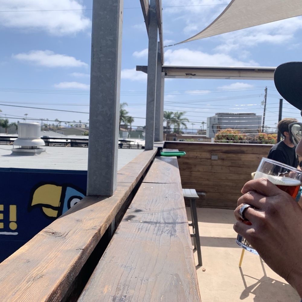 Green Cheek Beer Co. - Balcony bat seating outside/upstairs. Ocean view on clear days. - Breweries Near Me - Oceanside, California Green Cheek Beer Co. - Balcony bat seating outside/upstairs. Ocean view on clear days. - Breweries Near Me - Oceanside, California