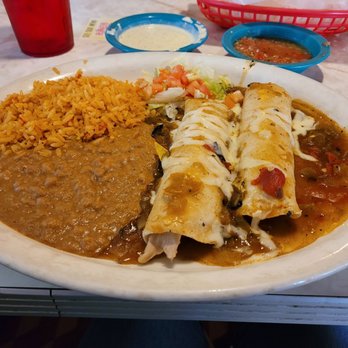 Chuy's - Chicka chicken boom enchiladas  with  hatch green chile sauce - Mexican Near Me - Houston, Texas