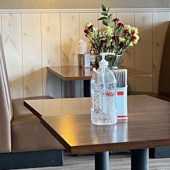 Gion Restaurant - a vase of flowers on a table - Vietnamese Near Me - New Hope, Minnesota Gion Restaurant - a vase of flowers on a table - Vietnamese Near Me - New Hope, Minnesota