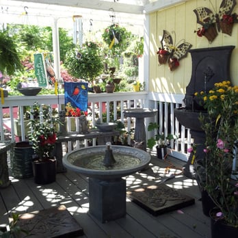 Whitaker Farms - a porch with a fountain and potted plants - Nurseries & Gardening Near Me - Franklinville, North Carolina