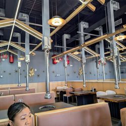 Ombu Hotpot & Korean BBQ - BBQ seating section
