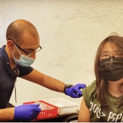 Dinuba Pharmacy - Pharmacist Mark finishing up Emiliano vaccine