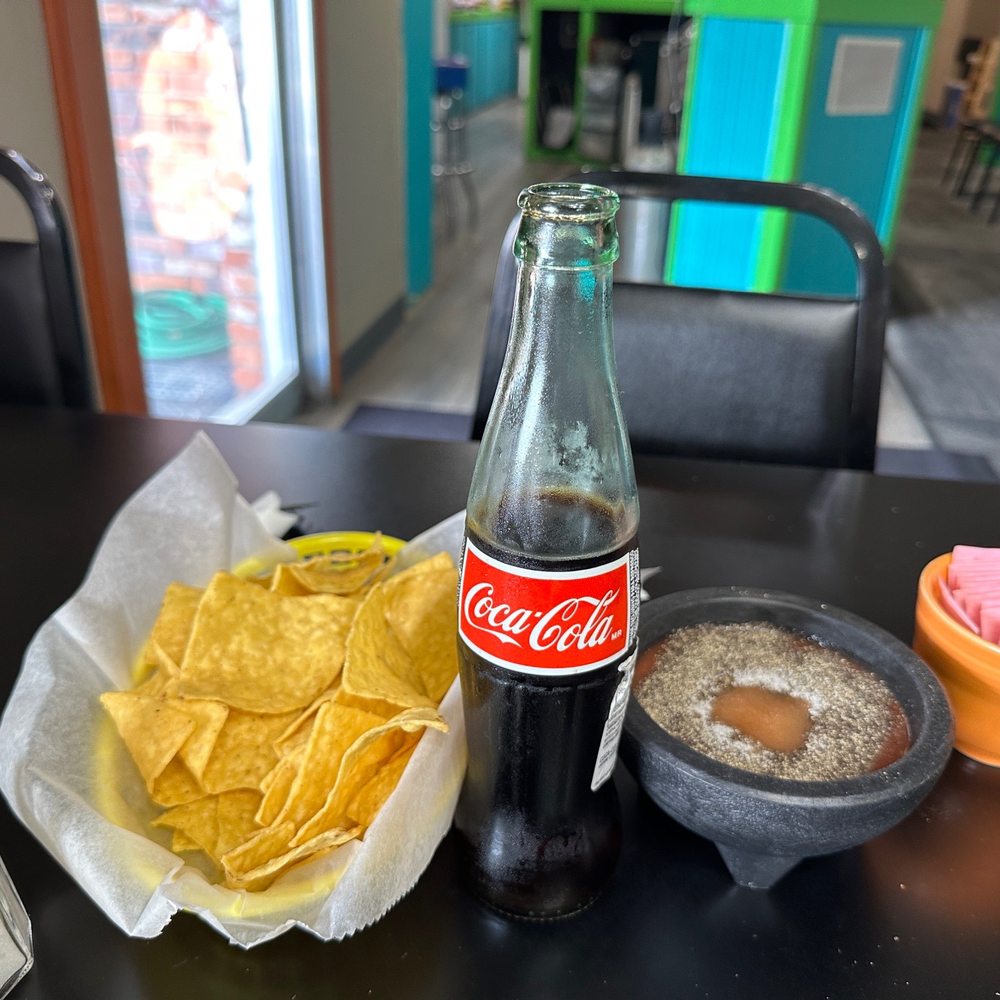 La Casa Del Rio - a bottle of coke, chips and a bowl of salsa - Mexican Near Me - North Platte, Nebraska