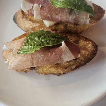 Mani Osteria & Bar - The daily crostini-provolone, prosciutto,  Basil with a balsamic glaze.  We ordered 4 of these! - Italian Near Me - Ann Arbor, Michigan