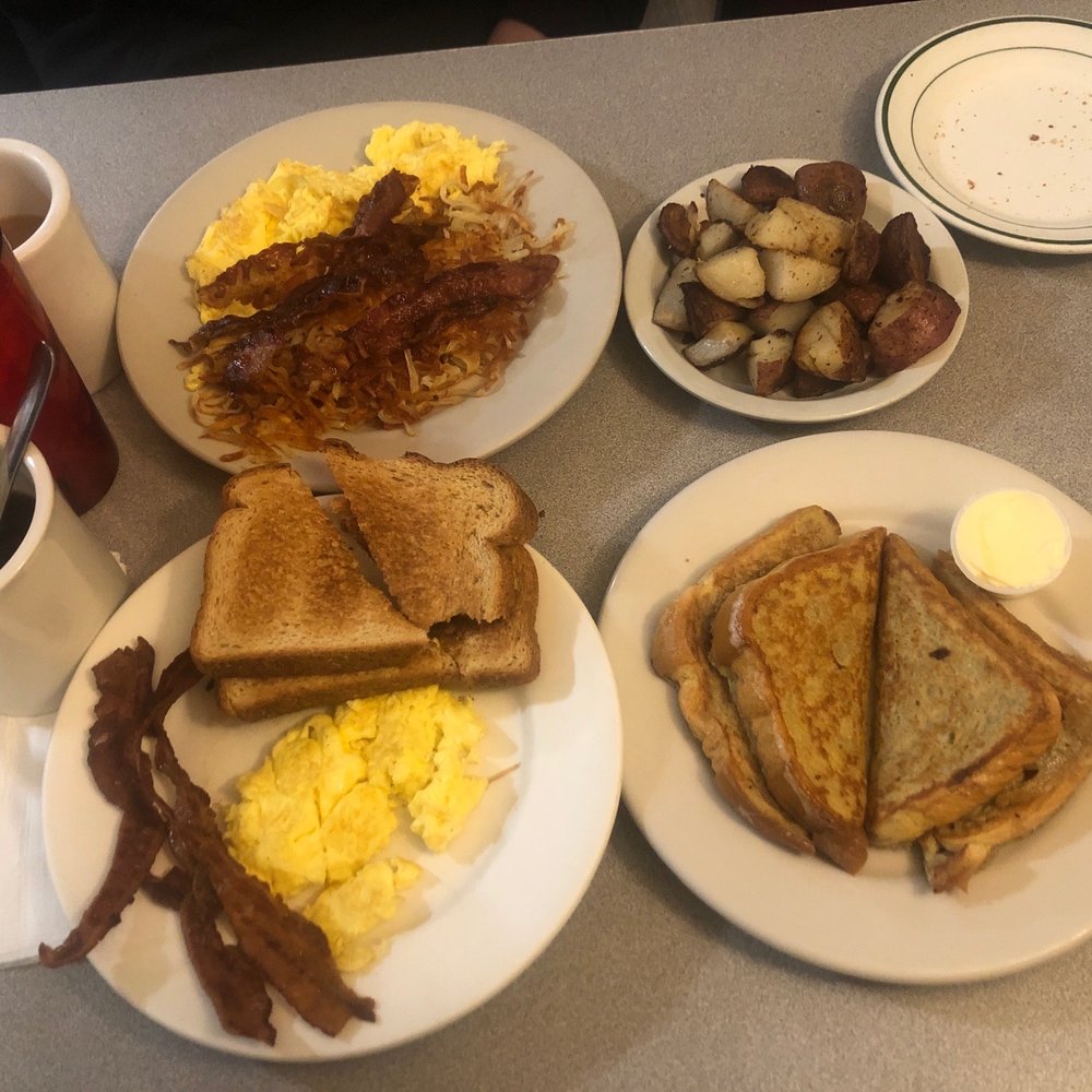 Eggs, hash browns, bacon, wheat toast, french toast and home fries ~ coffee & diet coke