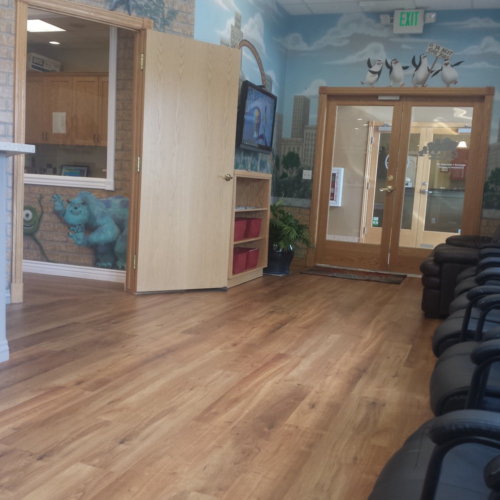 Kids Town Pediatric Dentistry - Front door and cartoons tv - Pediatric Dentists Near Me - Roy, Utah Kids Town Pediatric Dentistry - Front door and cartoons tv - Pediatric Dentists Near Me - Roy, Utah