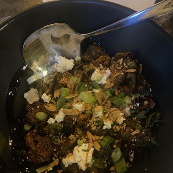 Succotash Southern and Creole Kitchen - Crispy Brussel sprouts tossed in lemon vinaigrette and drizzled with balsamic glaze toped with Bulgarian feta and crispy fried shallots. - Southern Near Me - Durham, North Carolina