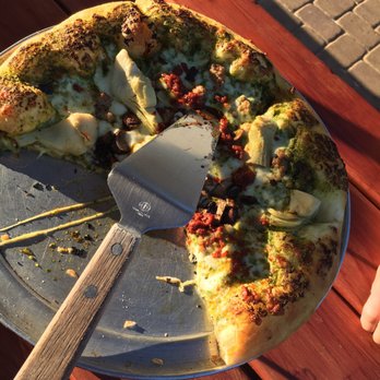Glenshire Pizza - a half eaten pizza on a plate - Pizza Near Me - Truckee, California Glenshire Pizza - a half eaten pizza on a plate - Pizza Near Me - Truckee, California