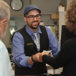 Best Collateral - Nick completes a transaction with a customer.