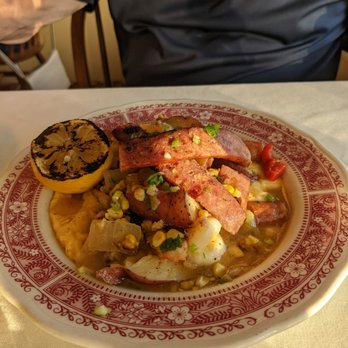 Red Rocker Inn - Frogmore stew over cheesy grits - Southern Near Me - Black Mountain, North Carolina