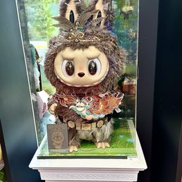 A giant Labubu doll. A giant Labubu doll.