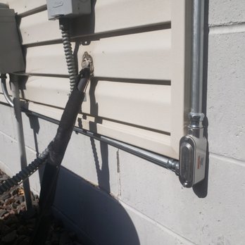 Silver Claw Electric - Keeping the EMT pipe close to the siding to avoid it being an eye sore for the customer - Electricians Near Me - Monticello, Minnesota