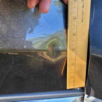 Eagle Eye Paintless Dent Removal - Pretty large dent and right on the car door's curvature!! - Mobile Dent Repair Near Me