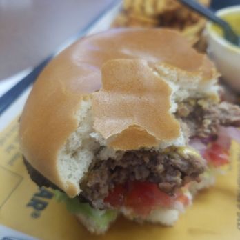 Carl's Jr - a half eaten hamburger - Burgers Near Me - Fresno, California