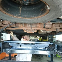 Rustoration - Doug inspecting surface rust under my 2002 Chevy Suburban.