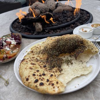 The Bench - Popping Pita bread (balloon bread) with a side of hummus and eggplant along with delicious beets and melted goat cheese - New American Near Me - Pebble Beach, California