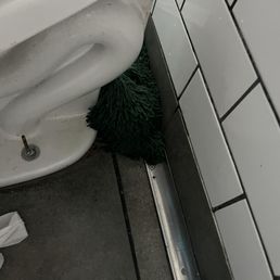 Toilet and dirty mop Toilet and dirty mop