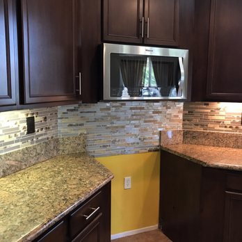 JL Construction - Backsplash and over the range microwave installation - General Contractors Near Me