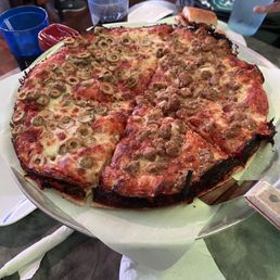 Medium pizza half Italian sausage half green olives