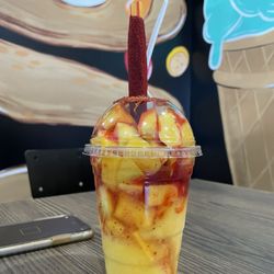 La Guera Jugos & Bionicos - Large mangoneada - has mango pieces, Tajín, chamois, squirt of lemon juice
