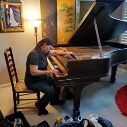 Sarah tuning a piano