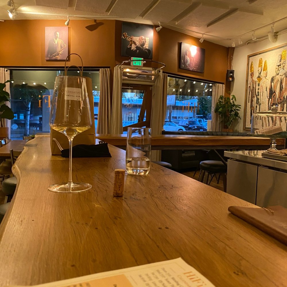 a glass of wine on the bar