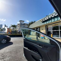 Exterior outside entrance of Ocean Food Mart - New Years Day 2021 Jan 1st views from car door and front of Ocean Mart. Beautiful South FL day - Boynton Beach, Florida Exterior outside entrance of Ocean Food Mart - New Years Day 2021 Jan 1st views from car door and front of Ocean Mart. Beautiful South FL day - Boynton Beach, Florida