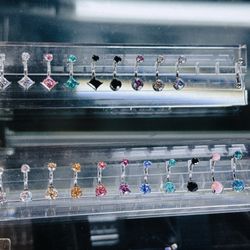 Steady Tattoo and Body Piercing - In LOVE with the top left diamond belly button ring. Makes me want a belly piercing!