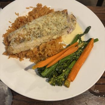 Captain Jack's Island Grill - White fish over fried rice with carrots and broccoli. Good dish. They catch the fish daily so everyday is different fish. Super fresh fish. - American Near Me - Lahaina, Hawaii