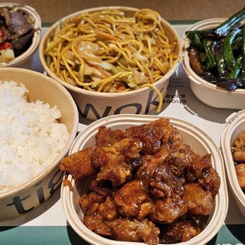 Tigawok - Rice and chow mein base, with mini bowls of Kung pao beef, eggplant/green beans, Tiga cola chicken, orange peel chicken - Chinese Near Me - Irvine, California Tigawok - Rice and chow mein base, with mini bowls of Kung pao beef, eggplant/green beans, Tiga cola chicken, orange peel chicken - Chinese Near Me - Irvine, California