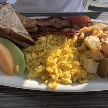 Eggsmart - Scrabble eggs with potatoes, turkey bacon, toast and fruit - Breakfast & Brunch Near Me - Mississauga, Ontario