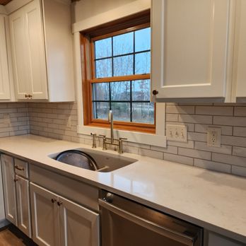 Nelson Home Repair - a kitchen with white cabinets and stainless steel appliances - Handyman Near Me Nelson Home Repair - a kitchen with white cabinets and stainless steel appliances - Handyman Near Me