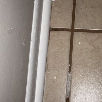 TCI Handyman and Window Cleaning Service - Paint on floor and in grout after cleaning grout. - Handyman Near Me