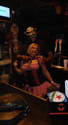 Photo of Gerri's Sports Pub - Margate, FL, US. a woman in a red dress and a man in a black shirt