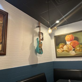 Back to Cuba - Wall art and a cool bass guitar in the dining room of Back to Cuba - Cuban Near Me - Nashville, Tennessee