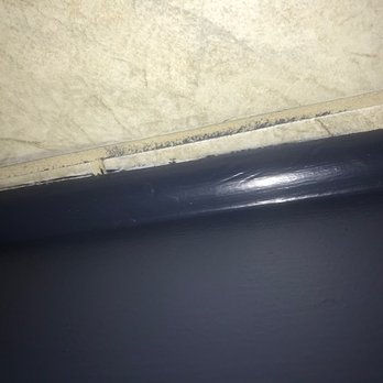 Glenny's Painting - The picture is up side down, but that's paint on my grout on our tile floors... - Painters Near Me
