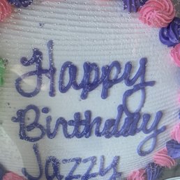 a birthday cake with pink and purple frosting a birthday cake with pink and purple frosting