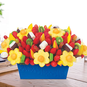 Edible Arrangements - a fruit arrangement in a blue container - Gift Shops Near Me - Eagan, Minnesota