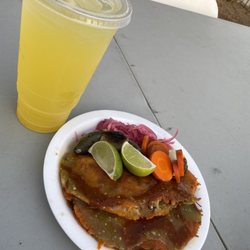 Arias Tacos - Al Pastor taco with Melted/Grilled cheese instead of a tortilla. Pickled red onions, and a grilled chili pepper. Piña Agua Fresca.