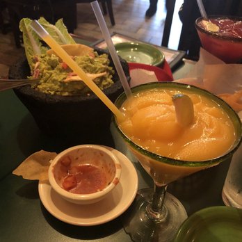 Los Tios Grill - Frozen Mango marg and blackberry on the rocks and fresh spicy guacamole - Salvadoran Near Me - Arlington, Virginia Los Tios Grill - Frozen Mango marg and blackberry on the rocks and fresh spicy guacamole - Salvadoran Near Me - Arlington, Virginia