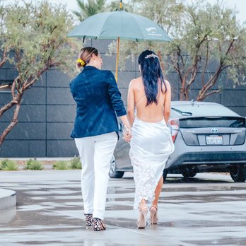 Mama B's Events - Event coordinator with Desert Vibe Events walking bride during the rain on her wedding day - Party & Event Planning Near Me