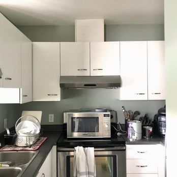 Paint Oasis - Really love the way Sage Wisdom works with the cupboards in this kitchen picture. - Painters Near Me