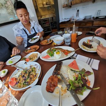 FOB Kitchen - Janice eating her ribs. Owner took a break to sit with us!! - Filipino Near Me - Oakland, California FOB Kitchen - Janice eating her ribs. Owner took a break to sit with us!! - Filipino Near Me - Oakland, California