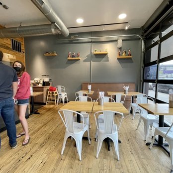 Asuka Ramen & Poke - a man and a woman in a restaurant - Ramen Near Me - Denver, Colorado Asuka Ramen & Poke - a man and a woman in a restaurant - Ramen Near Me - Denver, Colorado