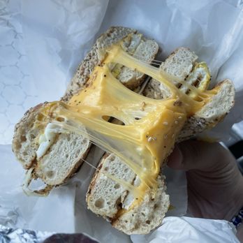 Daily Grind - Holy Cheese Pull!! Egg and Cheddar Cheese on an Everything Bagel! Super flavorful, and fresh for a great price! - Coffee & Tea Near Me - Unionville, Connecticut