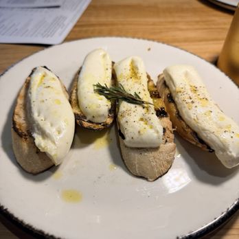 Brasswood Bar + Kitchen - The mozzarella loaded up then they drizzle the plates seasoning over the top. - American Near Me - Saint Helena, California Brasswood Bar + Kitchen - The mozzarella loaded up then they drizzle the plates seasoning over the top. - American Near Me - Saint Helena, California