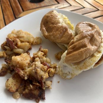 YiaYia's Cafe - Egg and Cheese w/ bacon, ham, or sausage with Home Fries   Egg Sandwich  Plain Bagel Cheese  Eggs  Sausage - Breakfast & Brunch Near Me - Middletown, Rhode Island